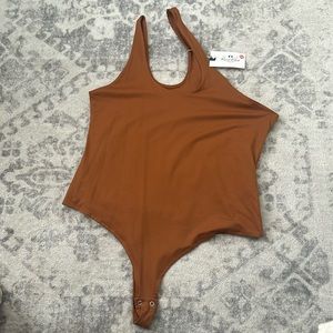Brown body suit